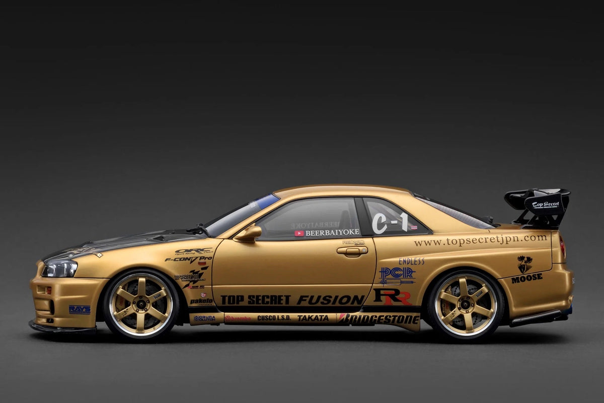 STM Diecast Ignition-Model Nissan Skyline GT-R R34 (BNR34) Top Secret Thailand 34GT-R Gold 1:18 -...