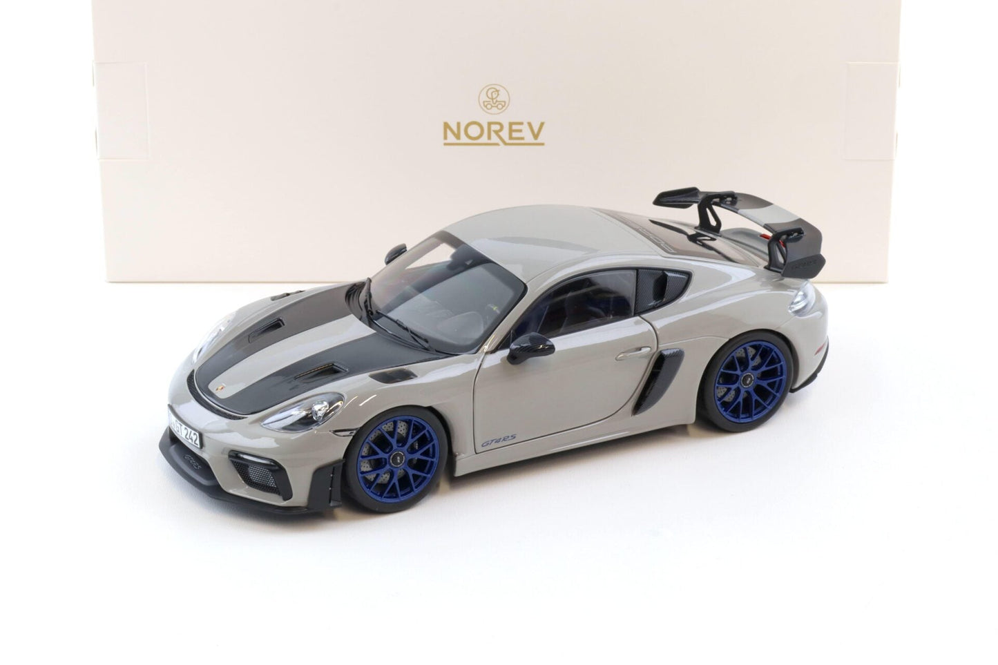 Norev 2023 Porsche 718 Cayman GT4 RS w/ Weissach Package Chalk w/ Blue Wheels 1:18