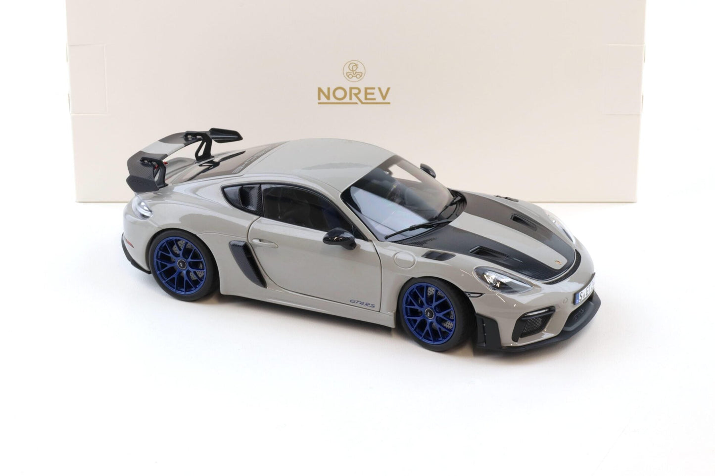 Norev 2023 Porsche 718 Cayman GT4 RS w/ Weissach Package Chalk w/ Blue Wheels 1:18