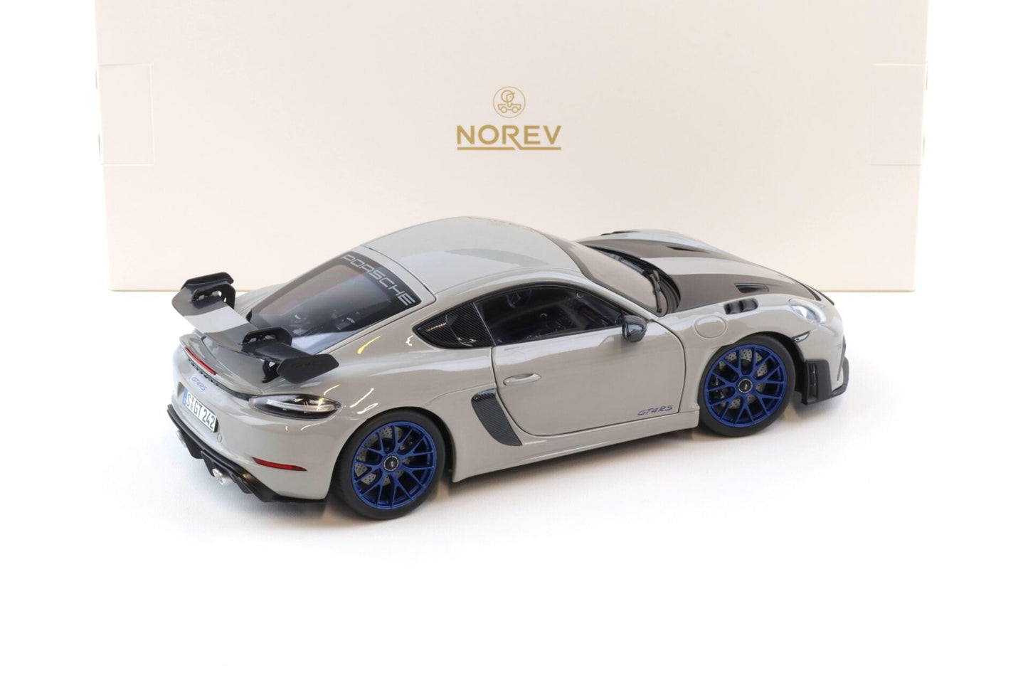 Norev 2023 Porsche 718 Cayman GT4 RS w/ Weissach Package Chalk w/ Blue Wheels 1:18