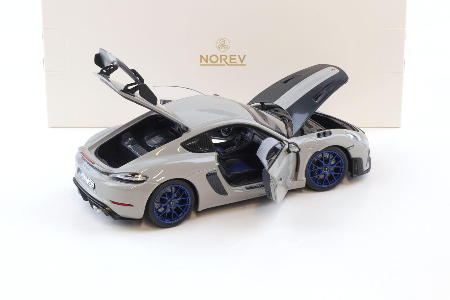 Norev 2023 Porsche 718 Cayman GT4 RS w/ Weissach Package Chalk w/ Blue Wheels 1:18
