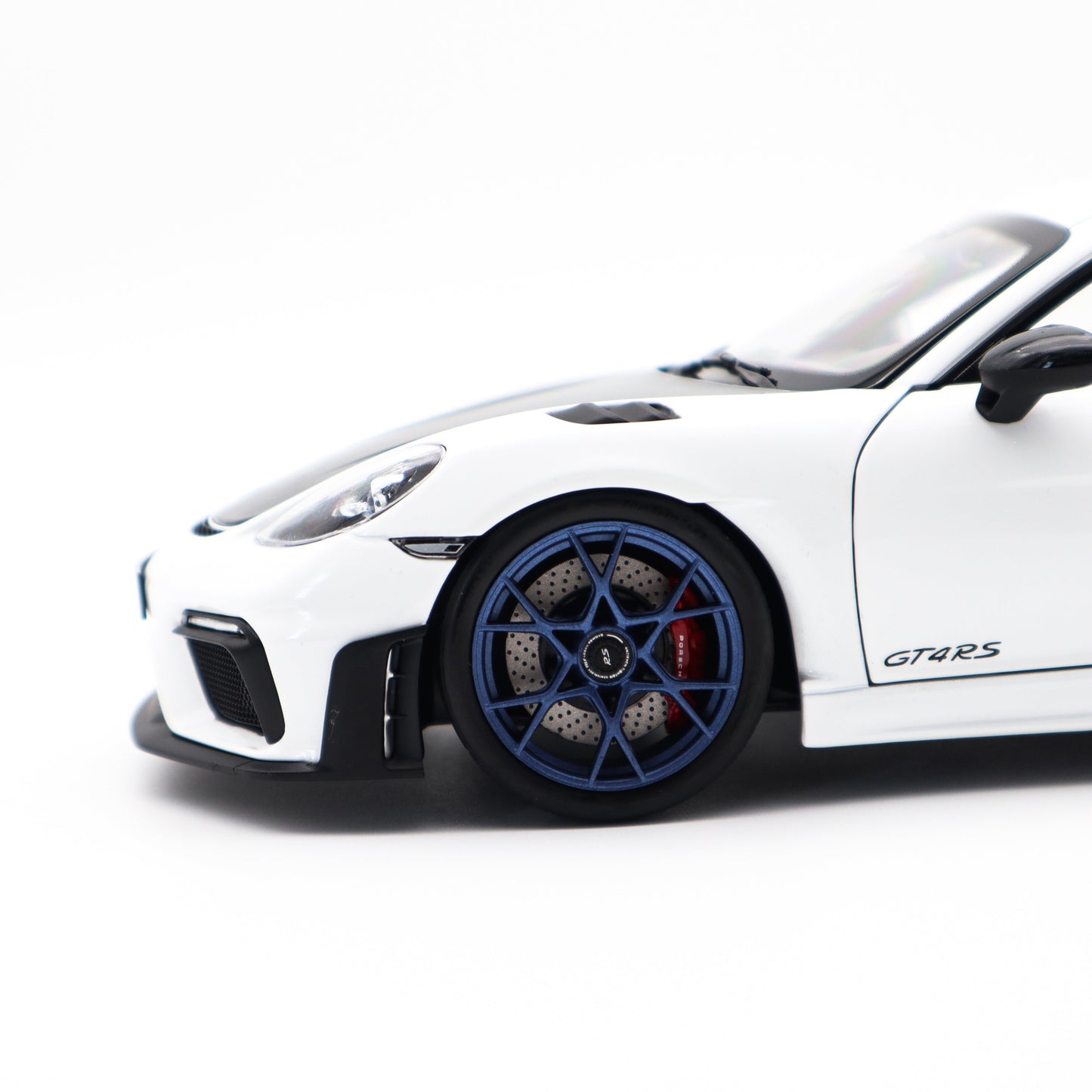 Norev 2023 Porsche 718 Cayman GT4 RS w/ Weissach Package White w/ Blue Wheels 1:18