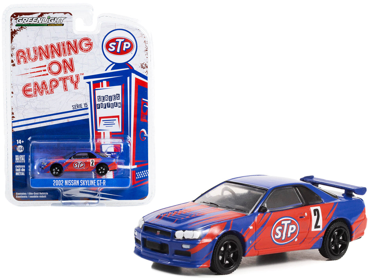 Rapid Vehicles 2002 Nissan Skyline GT-R (R34) #2 Blue with Red Graphics "STP" "Running on Empty"...