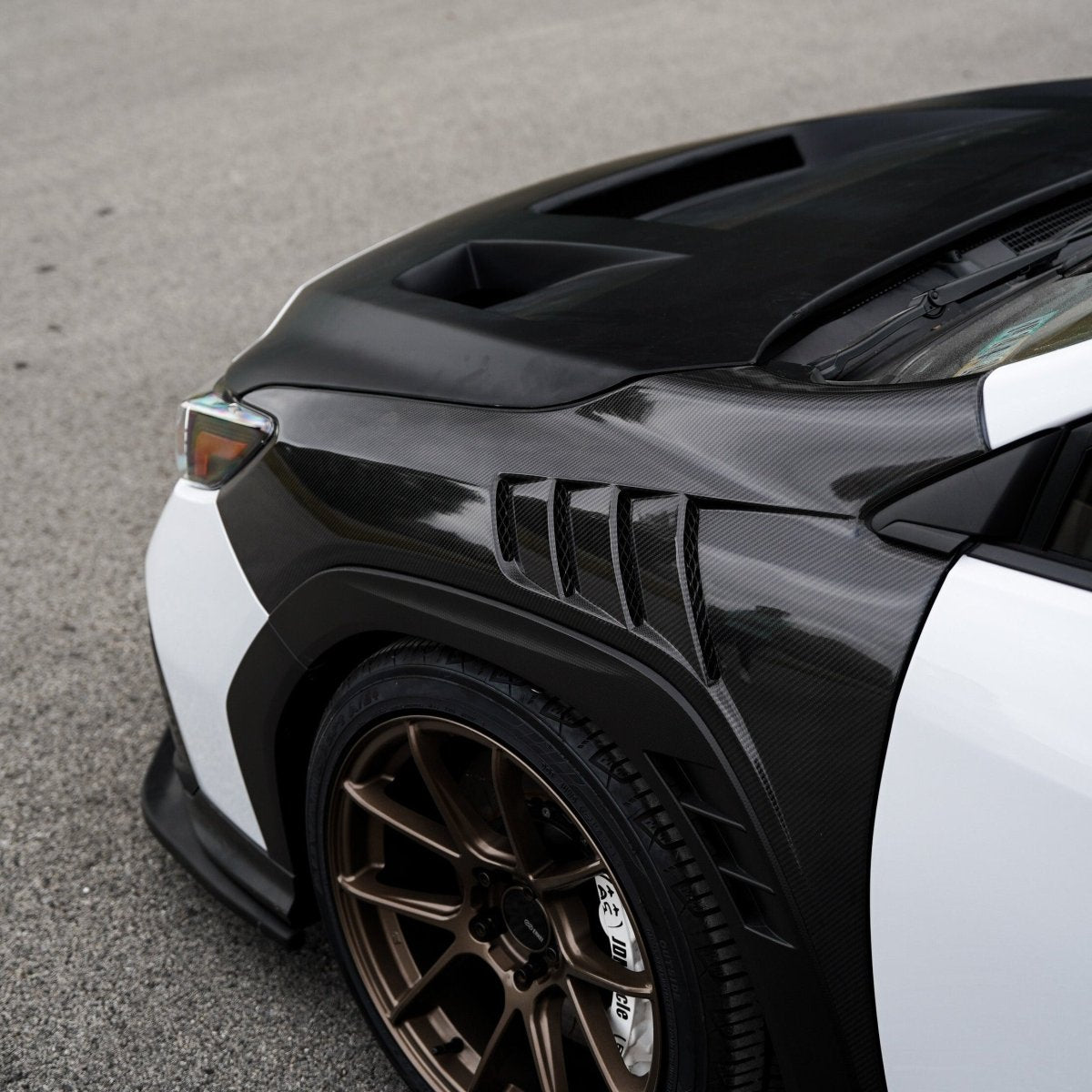 JDMuscle [22-25 WRX w/ FMIC] Carbon Fiber Scoopless Hood V1 - View 5