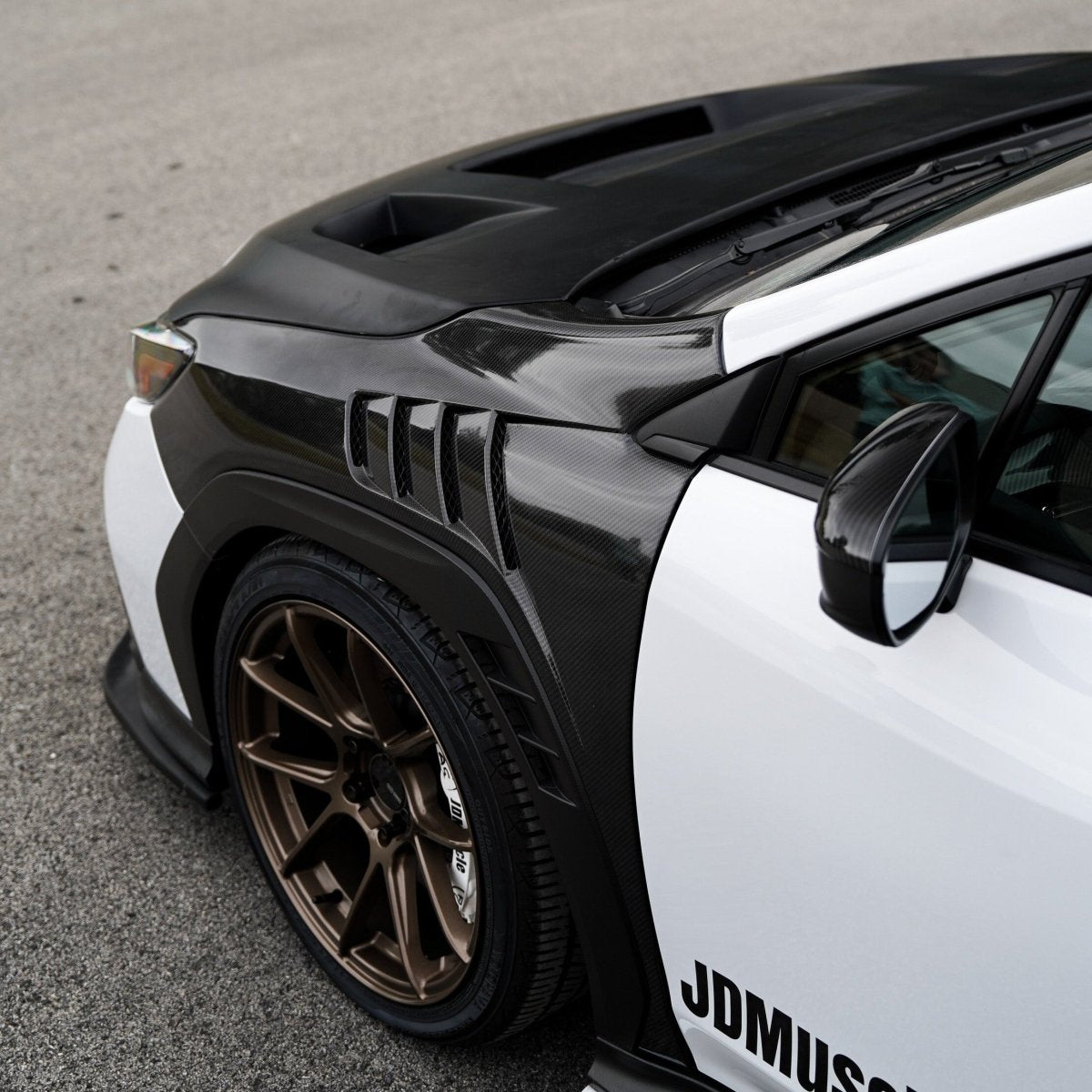 JDMuscle [22-25 WRX w/ FMIC] Carbon Fiber Scoopless Hood V1 - View 7