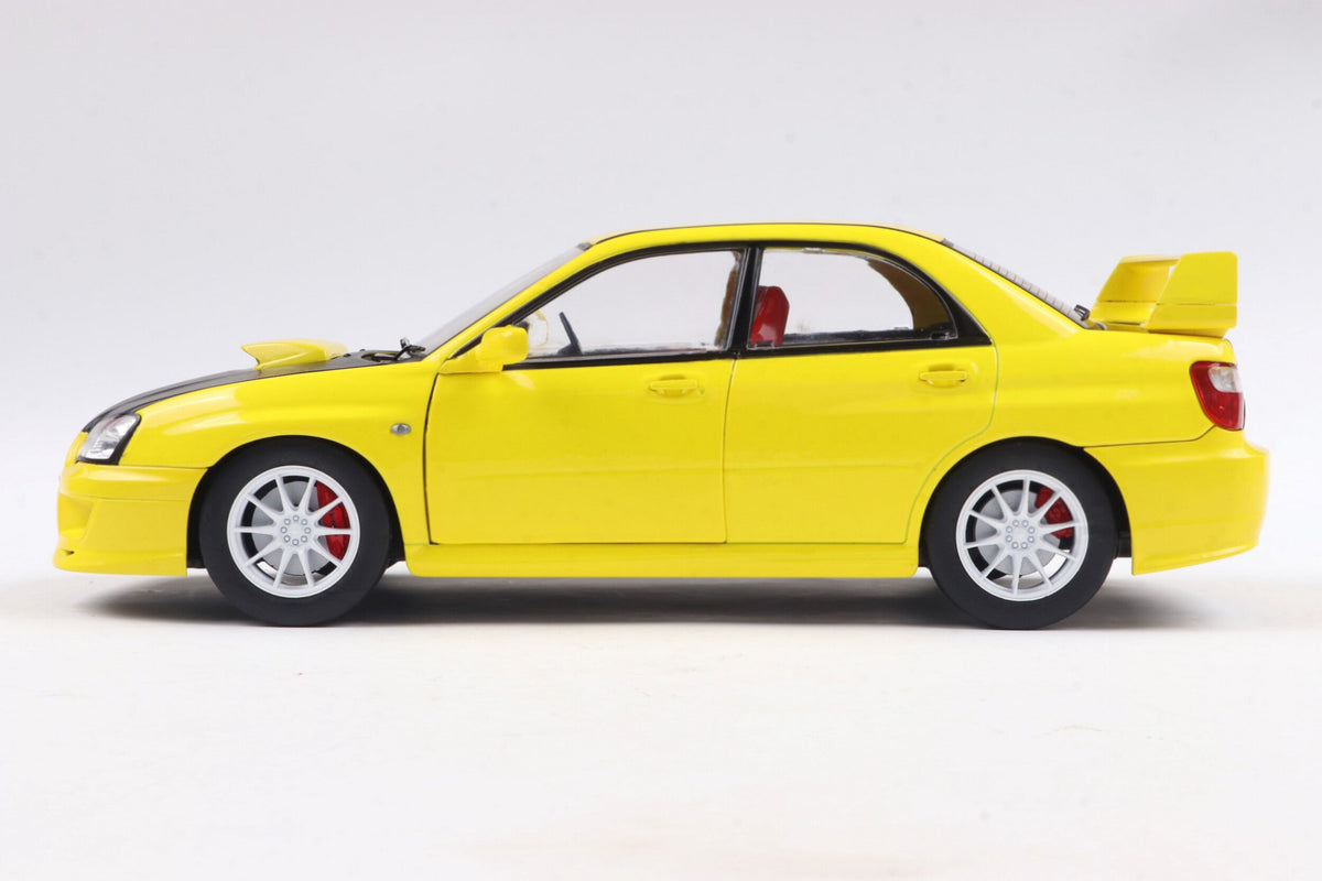 STM Diecast Solido 2003 Subaru WRX STi (GDB) Streetfighter Yellow w/ Black Carbon Hood 1:18 - View 2